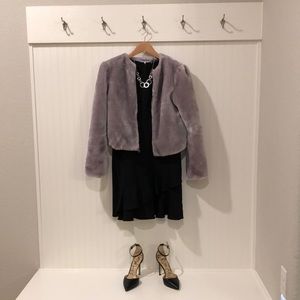 Little black dress # 2, asymmetrical ruffle at bottom, fitted in waist.